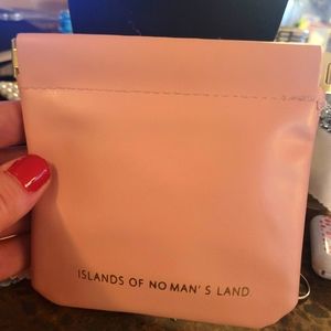 Small pink vegan leather travel bag